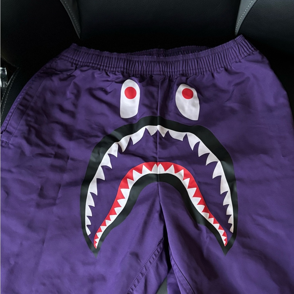 Purple bathing ape shorts.